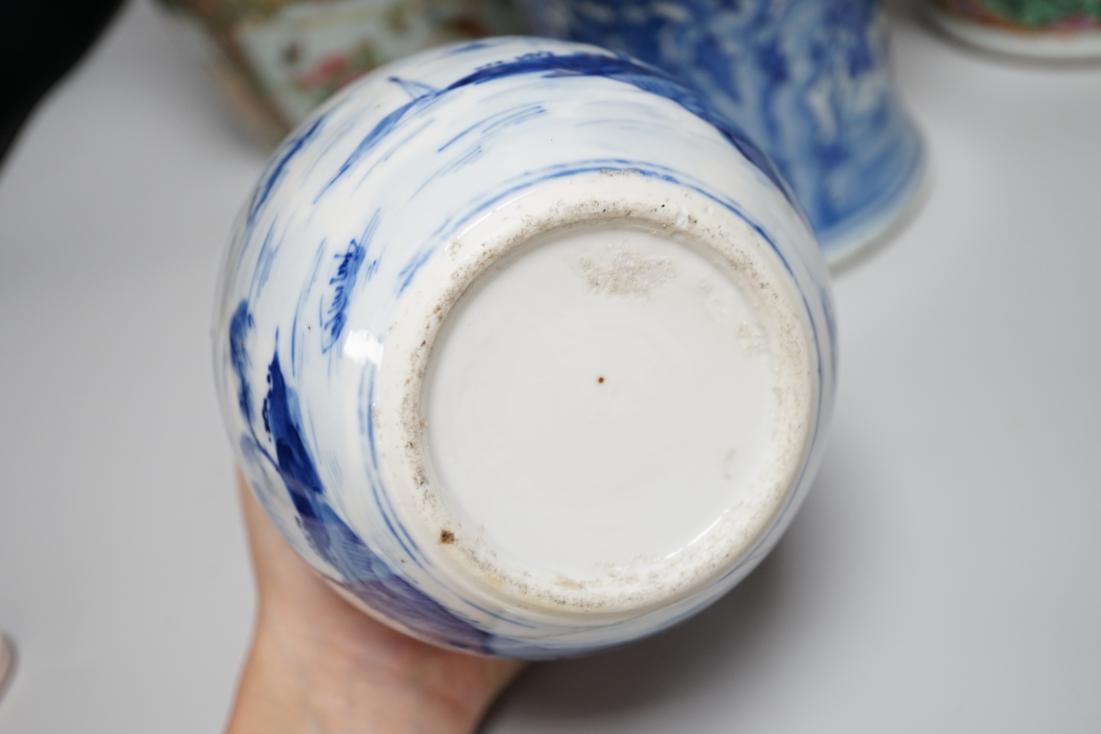 A pair of Chinese Canton decorated famille rose enamelled vases, 36cm high, an early 20th century Chinese blue and white baluster vase, 25cm (a.f.), a 19th century Chinese blue and white gu shaped vase, 37.5cm (a.f.), a